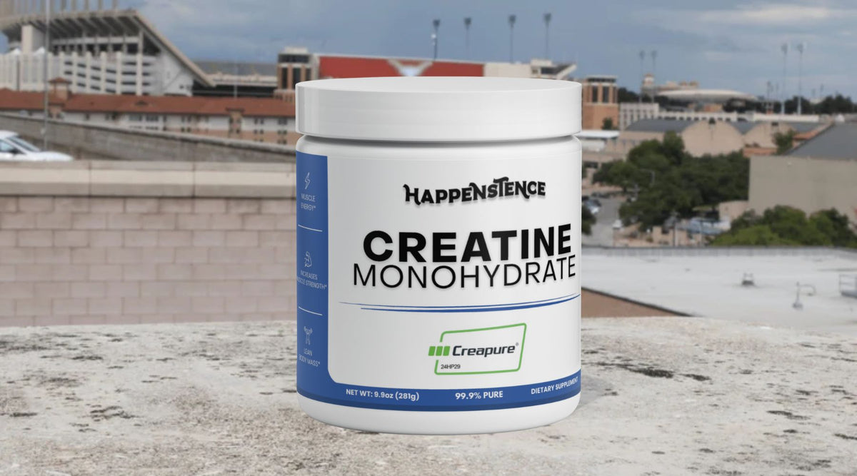 Happenstence Creatine Monohydrate tub on a ledge next to a football stadium