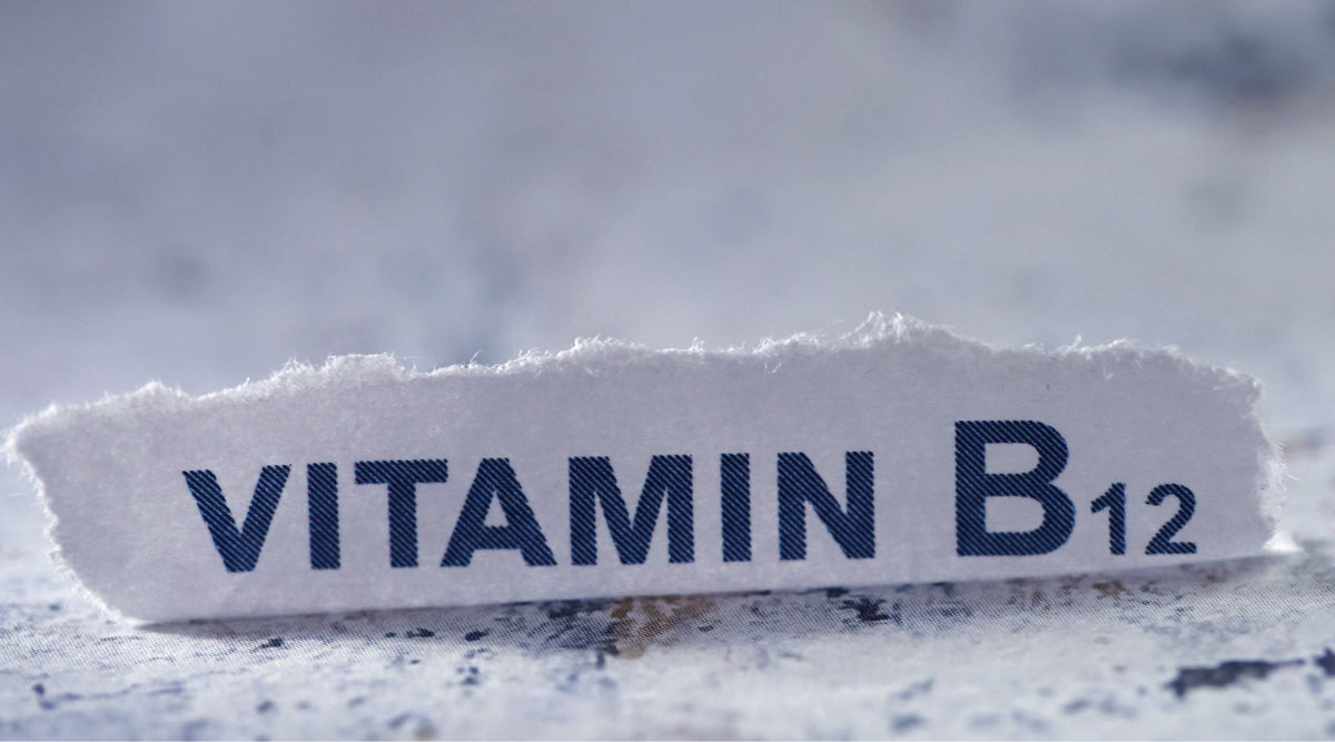 Vitamin B12 on a torn sheet of paper on a countertop