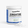 Jar of Happenstence Creatine Monohydrate on a white background with spilt powder